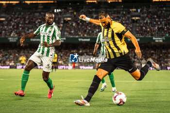 2024-08-03 - Karim Benzema from Al Ittihad and Youssouf Sabaly from Real Betis during the Friendly football match between Real Betis and Al Ittihad on 3 August 2024 at Benito Villamarín stadium in Sevilla, Spain - FOOTBALL - FRIENDLY GAME - REAL BETIS V AL ITTIHAD - FRIENDLY MATCH - SOCCER