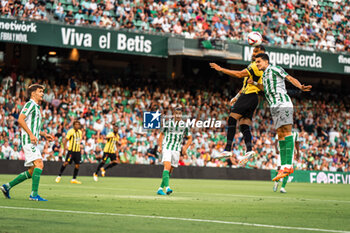 2024-08-03 - Karim Benzema from Al Ittihad and Marc Bartra from Real Betis during the Friendly football match between Real Betis and Al Ittihad on 3 August 2024 at Benito Villamarín stadium in Sevilla, Spain - FOOTBALL - FRIENDLY GAME - REAL BETIS V AL ITTIHAD - FRIENDLY MATCH - SOCCER