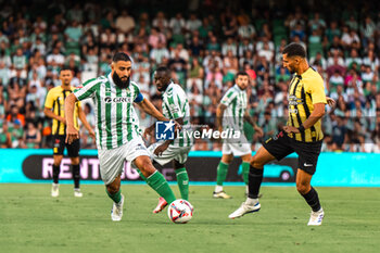 2024-08-03 - Nabil Fekir from Real Betis and Houssem Aouar from Al Ittihad during the Friendly football match between Real Betis and Al Ittihad on 3 August 2024 at Benito Villamarín stadium in Sevilla, Spain - FOOTBALL - FRIENDLY GAME - REAL BETIS V AL ITTIHAD - FRIENDLY MATCH - SOCCER