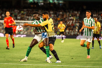 2024-08-03 - Saleh Al-Shehri from Al Ittihad and Nobel Mendy from Real Betis during the Friendly football match between Real Betis and Al Ittihad on 3 August 2024 at Benito Villamarín stadium in Sevilla, Spain - FOOTBALL - FRIENDLY GAME - REAL BETIS V AL ITTIHAD - FRIENDLY MATCH - SOCCER