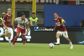 2024-08-13 - Davide Calabria of AC Milan  competes for the ball with Andrea Carboni of AC Monza during AC Milan vs AC Monza , 2° edition of 