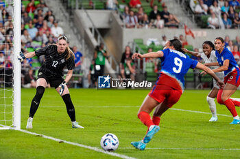 2024-10-24 - Iceland goalkeeper Telma Ivarsdottir (12) looks on as United States forward Mallory Swanson (9) attempts to set up a scoring chance - USA WOMEN VS ICELAND WOMEN - FRIENDLY MATCH - SOCCER