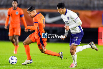 2024-11-18 - Anass Salah-Eddine of Netherlands and Jobe Bellingham of England during the U21 International Friendly football match between Netherlands and England on November 18, 2024 at Yanmar Stadion in Almere, Netherlands - FOOTBALL - UNDER 21 FRIENDLY GAME - NETHERLANDS V ENGLAND - FRIENDLY MATCH - SOCCER