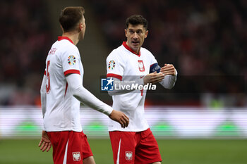 2024-02-25 - Jan Bednarek and Robert Lewandowski of Poland during the UEFA Euro 2024, Play-off football match between Poland and Estonia on March 21, 2024 at PGE Narodowy stadium in Warsaw, Poland - FOOTBALL - EURO 2024 - PLAY OFF - POLAND V ESTONIA - UEFA EUROPEAN - SOCCER