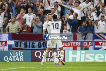 2024-06-30 - England midfielder Jude Bellingham scores a goal 1-1 and celebrates with England forward Harry Kane during the UEFA Euro 2024, Round of 16 football match between England and Slovakia on 30 June 2024 at Veltins-Arena in Gelsenkirchen, Germany - FOOTBALL - EURO 2024 - 1/8 - ENGLAND V SLOVAKIA - UEFA EUROPEAN - SOCCER