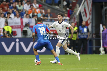 2024-06-30 - England midfielder Declan Rice and Slovakia David Strelec during the UEFA Euro 2024, Round of 16 football match between England and Slovakia on 30 June 2024 at Veltins-Arena in Gelsenkirchen, Germany - FOOTBALL - EURO 2024 - 1/8 - ENGLAND V SLOVAKIA - UEFA EUROPEAN - SOCCER