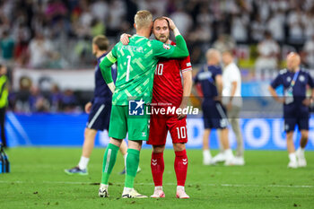 2024-06-29 - Christian Eriksen and Kasper Schmeichel of Denmark look dejected at full time during the UEFA Euro 2024, Round of 16 football match between Germany and Denmark on 29 June 2024 at Signal Iduna Park in Dortmund, Germany - FOOTBALL - EURO 2024 - 1/8 - GERMANY V DENMARK - UEFA EUROPEAN - SOCCER