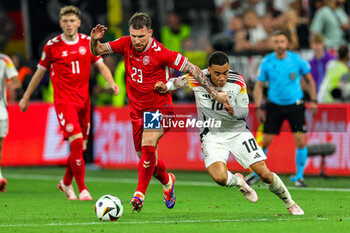 2024-06-29 - Jamal Musiala of Germany battles with Pierre-Emile Hojbjerg of Denmark during the UEFA Euro 2024, Round of 16 football match between Germany and Denmark on 29 June 2024 at Signal Iduna Park in Dortmund, Germany - FOOTBALL - EURO 2024 - 1/8 - GERMANY V DENMARK - UEFA EUROPEAN - SOCCER