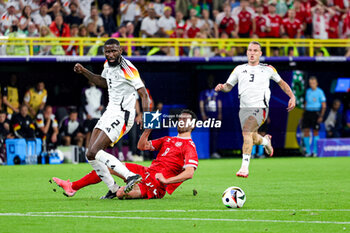 2024-06-29 - Antonio Rüdiger of Germany battles with Thomas Delaney of Denmark during the UEFA Euro 2024, Round of 16 football match between Germany and Denmark on 29 June 2024 at Signal Iduna Park in Dortmund, Germany - FOOTBALL - EURO 2024 - 1/8 - GERMANY V DENMARK - UEFA EUROPEAN - SOCCER