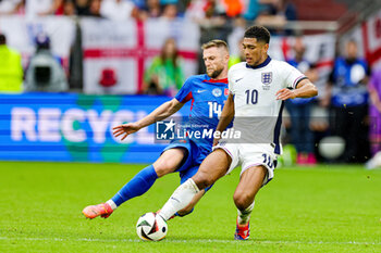 2024-07-01 - Milan Skriniar of Slovakia brings down Jude Bellingham of England during the UEFA Euro 2024, Round of 16 football match between England and Slovakia on 30 June 2024 at Veltins-Arena in Gelsenkirchen, Germany - FOOTBALL - EURO 2024 - 1/8 - ENGLAND V SLOVAKIA - UEFA EUROPEAN - SOCCER