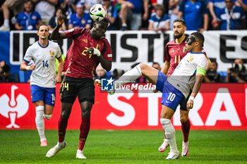 2024-07-01 - Amadou ONANA of Belgium, Kylian MBAPPE of France and Yannick CARRASCO of Belgium during the UEFA Euro 2024, Round of 16 football match between France and Belgium on 1 July 2024 at Merkur Spiel-Arena in Dusseldorf, Germany - FOOTBALL - EURO 2024 - 1/8 - FRANCE V BELGIUM - UEFA EUROPEAN - SOCCER