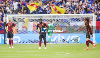 2024-07-01 - Orel Mangala of Belgium and Wout Faes of Belgium look dejected during the UEFA Euro 2024, Round of 16 football match between France and Belgium on 1 July 2024 at Merkur Spiel-Arena in Dusseldorf, Germany - FOOTBALL - EURO 2024 - 1/8 - FRANCE V BELGIUM - UEFA EUROPEAN - SOCCER