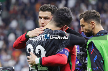 2024-07-01 - Goalkeeper Diogo Costa of Portugal celebrates with Cristiano Ronaldo after the penalty shoot-out during the UEFA Euro 2024, Round of 16 football match between Portugal and Slovenia on 1July 2024 at Deutsche Bank Park in Frankfurt, Germany - FOOTBALL - EURO 2024 - 1/8 - PORTUGAL V SLOVENIA - UEFA EUROPEAN - SOCCER