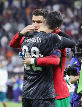 2024-07-01 - Goalkeeper Diogo Costa of Portugal celebrates with Cristiano Ronaldo after the penalty shoot-out during the UEFA Euro 2024, Round of 16 football match between Portugal and Slovenia on 1July 2024 at Deutsche Bank Park in Frankfurt, Germany - FOOTBALL - EURO 2024 - 1/8 - PORTUGAL V SLOVENIA - UEFA EUROPEAN - SOCCER