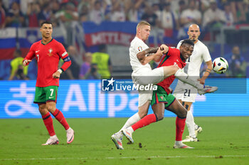 2024-07-01 - Zan Karnicnik of Slovenia and Rafael Leao of Portugal during the UEFA Euro 2024, Round of 16 football match between Portugal and Slovenia on 1July 2024 at Deutsche Bank Park in Frankfurt, Germany - FOOTBALL - EURO 2024 - 1/8 - PORTUGAL V SLOVENIA - UEFA EUROPEAN - SOCCER