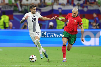 2024-07-01 - Petar Stojanovic of Slovenia and Pepe of Portugal during the UEFA Euro 2024, Round of 16 football match between Portugal and Slovenia on 1July 2024 at Deutsche Bank Park in Frankfurt, Germany - FOOTBALL - EURO 2024 - 1/8 - PORTUGAL V SLOVENIA - UEFA EUROPEAN - SOCCER