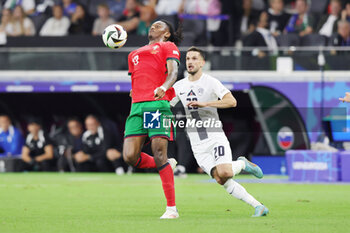 2024-07-01 - Rafael Leao of Portugal and Petar Stojanovic of Slovenia during the UEFA Euro 2024, Round of 16 football match between Portugal and Slovenia on 1July 2024 at Deutsche Bank Park in Frankfurt, Germany - FOOTBALL - EURO 2024 - 1/8 - PORTUGAL V SLOVENIA - UEFA EUROPEAN - SOCCER