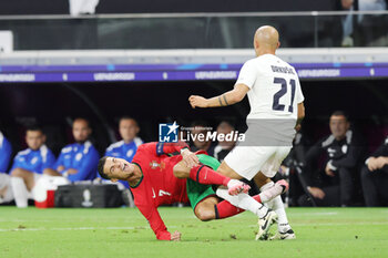 2024-07-01 - Cristiano Ronaldo of Portugal and Vanja Drkusic of Slovenia during the UEFA Euro 2024, Round of 16 football match between Portugal and Slovenia on 1July 2024 at Deutsche Bank Park in Frankfurt, Germany - FOOTBALL - EURO 2024 - 1/8 - PORTUGAL V SLOVENIA - UEFA EUROPEAN - SOCCER