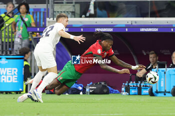 2024-07-01 - Adam Gnezda Cerin of Slovenia and Rafael Leao of Portugal during the UEFA Euro 2024, Round of 16 football match between Portugal and Slovenia on 1July 2024 at Deutsche Bank Park in Frankfurt, Germany - FOOTBALL - EURO 2024 - 1/8 - PORTUGAL V SLOVENIA - UEFA EUROPEAN - SOCCER