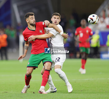 2024-07-01 - Bruno Fernandes of Portugal and Adam Gnezda Cerin of Slovenia during the UEFA Euro 2024, Round of 16 football match between Portugal and Slovenia on 1July 2024 at Deutsche Bank Park in Frankfurt, Germany - FOOTBALL - EURO 2024 - 1/8 - PORTUGAL V SLOVENIA - UEFA EUROPEAN - SOCCER