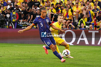 2024-07-02 - Nathan Aké of Netherlands, Denis Dragus of Romania during the UEFA Euro 2024, Round of 16 football match between Romania and Netherlands on July 2, 2024 at Allianz Arena in Munich, Germany - FOOTBALL - EURO 2024 - 1/8 - ROMANIA V NETHERLANDS - UEFA EUROPEAN - SOCCER