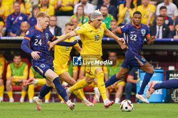 2024-07-02 - Jerdy Schouten of Netherlands, Ianis Hagi of Romania during the UEFA Euro 2024, Round of 16 football match between Romania and Netherlands on July 2, 2024 at Allianz Arena in Munich, Germany - FOOTBALL - EURO 2024 - 1/8 - ROMANIA V NETHERLANDS - UEFA EUROPEAN - SOCCER