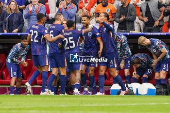 2024-07-02 - Cody Gakpo of Netherlands celebrates with his teammates after scoring his teams first goal during the UEFA Euro 2024, Round of 16 football match between Romania and Netherlands on July 2, 2024 at Allianz Arena in Munich, Germany - FOOTBALL - EURO 2024 - 1/8 - ROMANIA V NETHERLANDS - UEFA EUROPEAN - SOCCER