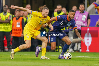 2024-07-02 - Radu Dragusin of Romania, Cody Gakpo of Netherlands during the UEFA Euro 2024, Round of 16 football match between Romania and Netherlands on July 2, 2024 at Allianz Arena in Munich, Germany - FOOTBALL - EURO 2024 - 1/8 - ROMANIA V NETHERLANDS - UEFA EUROPEAN - SOCCER