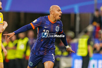 2024-07-02 - Donyell Malen of Netherlands celebrates after scoring his teams third goal during the UEFA Euro 2024, Round of 16 football match between Romania and Netherlands on July 2, 2024 at Allianz Arena in Munich, Germany - FOOTBALL - EURO 2024 - 1/8 - ROMANIA V NETHERLANDS - UEFA EUROPEAN - SOCCER