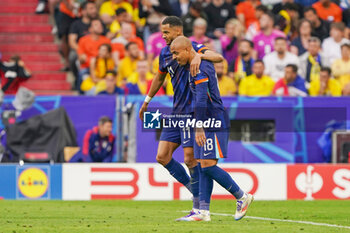 2024-07-02 - Cody Gakpo of Netherlands, Donyell Malen of Netherlands are celebrating their teams second goal during the UEFA Euro 2024, Round of 16 football match between Romania and Netherlands on July 2, 2024 at Allianz Arena in Munich, Germany - FOOTBALL - EURO 2024 - 1/8 - ROMANIA V NETHERLANDS - UEFA EUROPEAN - SOCCER