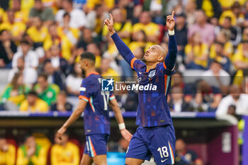 2024-07-02 - Donyell Malen of Netherlands celebrates after scoring his teams second goal during the UEFA Euro 2024, Round of 16 football match between Romania and Netherlands on July 2, 2024 at Allianz Arena in Munich, Germany - FOOTBALL - EURO 2024 - 1/8 - ROMANIA V NETHERLANDS - UEFA EUROPEAN - SOCCER