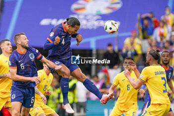 2024-07-02 - Stefan De Vrij of Netherlands, header of Virgil van Dijk of Netherlands during the UEFA Euro 2024, Round of 16 football match between Romania and Netherlands on July 2, 2024 at Allianz Arena in Munich, Germany - FOOTBALL - EURO 2024 - 1/8 - ROMANIA V NETHERLANDS - UEFA EUROPEAN - SOCCER