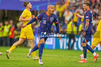 2024-07-02 - Donyell Malen of Netherlands celebrates after scoring his teams third goal during the UEFA Euro 2024, Round of 16 football match between Romania and Netherlands on July 2, 2024 at Allianz Arena in Munich, Germany - FOOTBALL - EURO 2024 - 1/8 - ROMANIA V NETHERLANDS - UEFA EUROPEAN - SOCCER