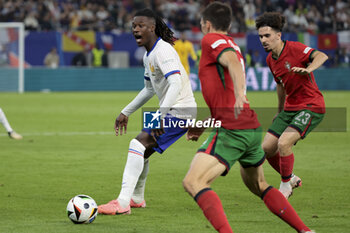 2024-07-05 - Eduardo Camavinga of France, Vitinha of Portugal during the UEFA Euro 2024, quarter-final football match between Portugal and France on July 5, 2024 at Volksparkstadion in Hamburg, Germany - FOOTBALL - EURO 2024 - 1/4 - PORTUGAL V FRANCE - UEFA EUROPEAN - SOCCER