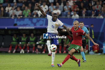 2024-07-05 - Randal Kolo Muani of France, Pepe of Portugal during the UEFA Euro 2024, quarter-final football match between Portugal and France on July 5, 2024 at Volksparkstadion in Hamburg, Germany - FOOTBALL - EURO 2024 - 1/4 - PORTUGAL V FRANCE - UEFA EUROPEAN - SOCCER