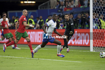 2024-07-05 - Randal Kolo Muani of France, left Pepe of Portugal during the UEFA Euro 2024, quarter-final football match between Portugal and France on July 5, 2024 at Volksparkstadion in Hamburg, Germany - FOOTBALL - EURO 2024 - 1/4 - PORTUGAL V FRANCE - UEFA EUROPEAN - SOCCER