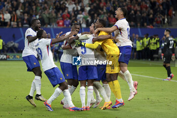 2024-07-05 - Dayot Upamecano, Youssouf Fofana, Marcus Thuram, Theo Hernandez, goalkeeper of France Mike Maignan, William Saliba of France celebrate winning the penalty shootout of the UEFA Euro 2024, quarter-final football match between Portugal and France on July 5, 2024 at Volksparkstadion in Hamburg, Germany - FOOTBALL - EURO 2024 - 1/4 - PORTUGAL V FRANCE - UEFA EUROPEAN - SOCCER