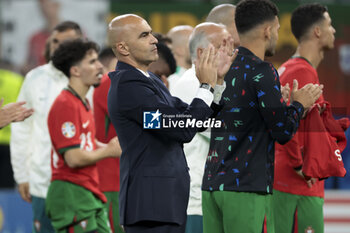 2024-07-05 - Coach of Portugal Roberto Martinez is dejected following the penalty shootout of the UEFA Euro 2024, quarter-final football match between Portugal and France on July 5, 2024 at Volksparkstadion in Hamburg, Germany - FOOTBALL - EURO 2024 - 1/4 - PORTUGAL V FRANCE - UEFA EUROPEAN - SOCCER