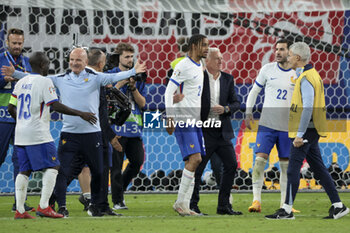 2024-07-05 - Assistant-coach of France Guy Stephan and coach of France Didier Deschamps celebrate the victory with their players, N'Golo Kante, Bradley Barcola, Theo Hernandez following the penalty shootout of the UEFA Euro 2024, quarter-final football match between Portugal and France on July 5, 2024 at Volksparkstadion in Hamburg, Germany - FOOTBALL - EURO 2024 - 1/4 - PORTUGAL V FRANCE - UEFA EUROPEAN - SOCCER