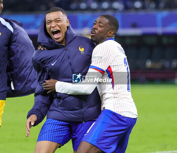 2024-07-05 - Kylian Mbappe and Ousmane Dembele of France celebrate the victory during the UEFA Euro 2024, Quarter-finals football match between Portugal and France on July 5, 2024 at Volksparkstadion in Hamburg, Germany - FOOTBALL - EURO 2024 - 1/4 - PORTUGAL V FRANCE - UEFA EUROPEAN - SOCCER