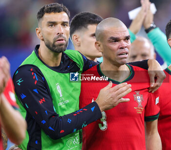 2024-07-05 - Goalkeeper Rui Patricio and Pepe of Portugal look dejected after the UEFA Euro 2024, Quarter-finals football match between Portugal and France on July 5, 2024 at Volksparkstadion in Hamburg, Germany - FOOTBALL - EURO 2024 - 1/4 - PORTUGAL V FRANCE - UEFA EUROPEAN - SOCCER