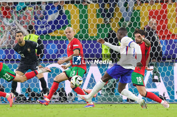 2024-07-05 - Ousmane Dembele of France and Pepe, Rúben Neves of Portugal during the UEFA Euro 2024, Quarter-finals football match between Portugal and France on July 5, 2024 at Volksparkstadion in Hamburg, Germany - FOOTBALL - EURO 2024 - 1/4 - PORTUGAL V FRANCE - UEFA EUROPEAN - SOCCER