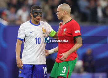 2024-07-05 - Kylian Mbappe of France and Pepe of Portugal during the UEFA Euro 2024, Quarter-finals football match between Portugal and France on July 5, 2024 at Volksparkstadion in Hamburg, Germany - FOOTBALL - EURO 2024 - 1/4 - PORTUGAL V FRANCE - UEFA EUROPEAN - SOCCER