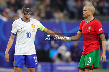 2024-07-05 - Kylian Mbappe of France and Pepe of Portugal during the UEFA Euro 2024, Quarter-finals football match between Portugal and France on July 5, 2024 at Volksparkstadion in Hamburg, Germany - FOOTBALL - EURO 2024 - 1/4 - PORTUGAL V FRANCE - UEFA EUROPEAN - SOCCER