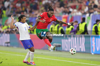 2024-07-05 - Jules Kounde of France and Rafael Leao of Portugal during the UEFA Euro 2024, Quarter-finals football match between Portugal and France on July 5, 2024 at Volksparkstadion in Hamburg, Germany - FOOTBALL - EURO 2024 - 1/4 - PORTUGAL V FRANCE - UEFA EUROPEAN - SOCCER