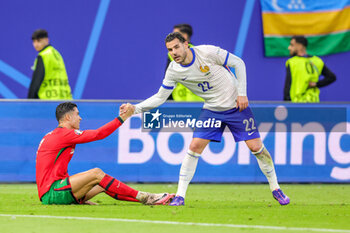 2024-07-05 - Cristiano Ronaldo of Portugal and Theo Hernandez of France during the UEFA Euro 2024, Quarter-finals football match between Portugal and France on July 5, 2024 at Volksparkstadion in Hamburg, Germany - FOOTBALL - EURO 2024 - 1/4 - PORTUGAL V FRANCE - UEFA EUROPEAN - SOCCER