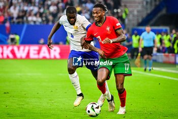 2024-07-05 - Dayot UPAMECANO of France and Rafael LEAO of Portugal during the UEFA Euro 2024, Quarter-finals football match between Portugal and France on July 5, 2024 at Volksparkstadion in Hamburg, Germany - FOOTBALL - EURO 2024 - 1/4 - PORTUGAL V FRANCE - UEFA EUROPEAN - SOCCER