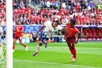 2024-07-07 - Ezri Konsa of England and Breel Embolo of Switzerland during the UEFA Euro 2024, Quarter-finals football match between England and Switzerland on July 6, 2024 at Merkur Spiel-Arena in Düsseldorf, Germany - FOOTBALL - EURO 2024 - 1/4 - ENGLAND V SWITZERLAND - UEFA EUROPEAN - SOCCER