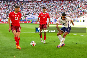 2024-07-07 - Jude Bellingham of England and Fabian Schar, Dan Ndoye of Switzerland during the UEFA Euro 2024, Quarter-finals football match between England and Switzerland on July 6, 2024 at Merkur Spiel-Arena in Düsseldorf, Germany - FOOTBALL - EURO 2024 - 1/4 - ENGLAND V SWITZERLAND - UEFA EUROPEAN - SOCCER