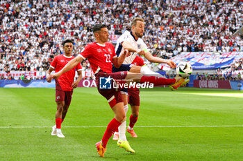 2024-07-07 - Harry Kane of England battles with Fabian Schar of Switzerland during the UEFA Euro 2024, Quarter-finals football match between England and Switzerland on July 6, 2024 at Merkur Spiel-Arena in Düsseldorf, Germany - FOOTBALL - EURO 2024 - 1/4 - ENGLAND V SWITZERLAND - UEFA EUROPEAN - SOCCER